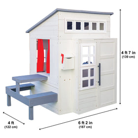 KidKraft white picnic table in playhouse for family snacks.