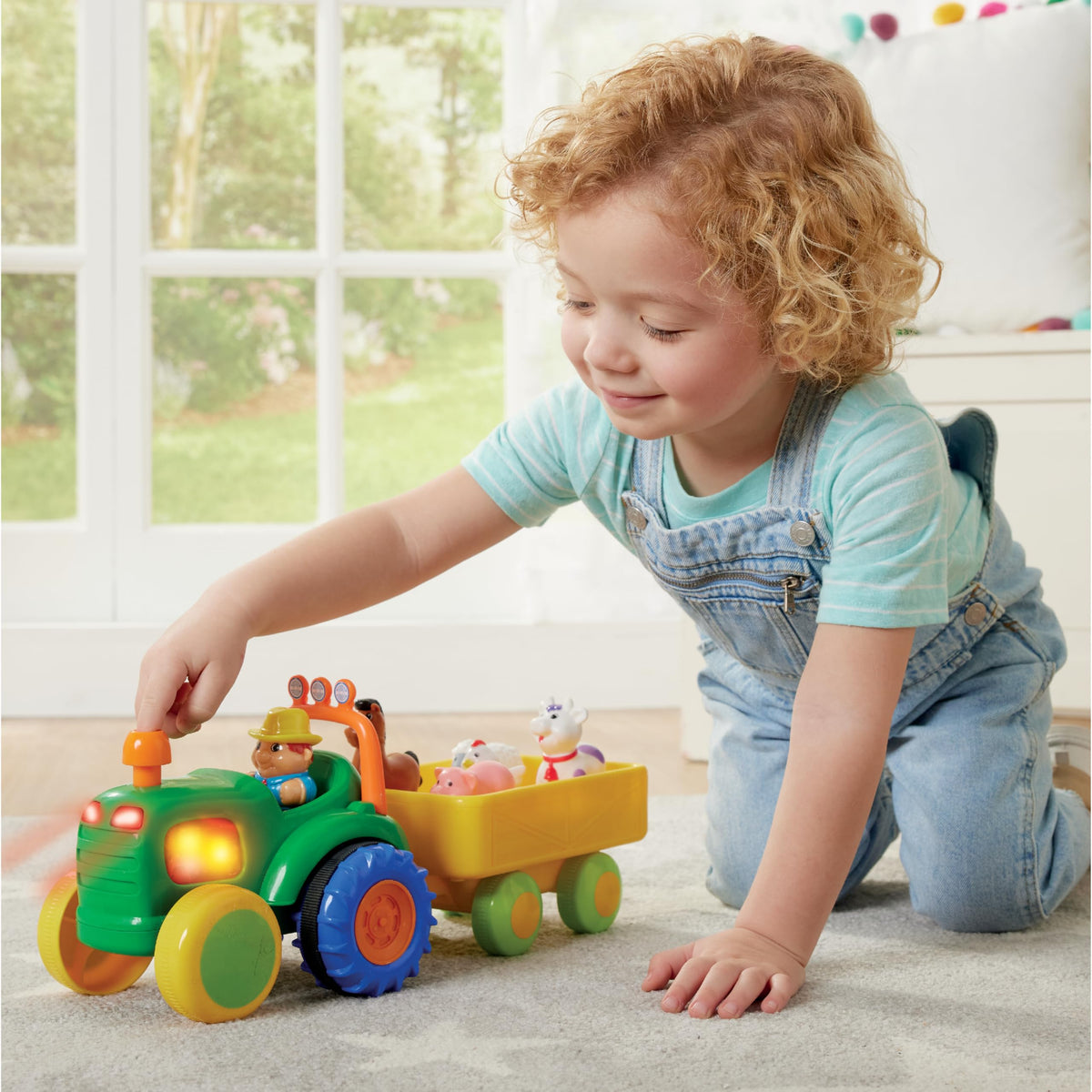 Kidoozie farmer figure seated in the tractor ready for role-play adventures.