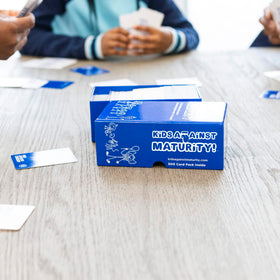 Family game night setup with Kids Against Maturity ready to play