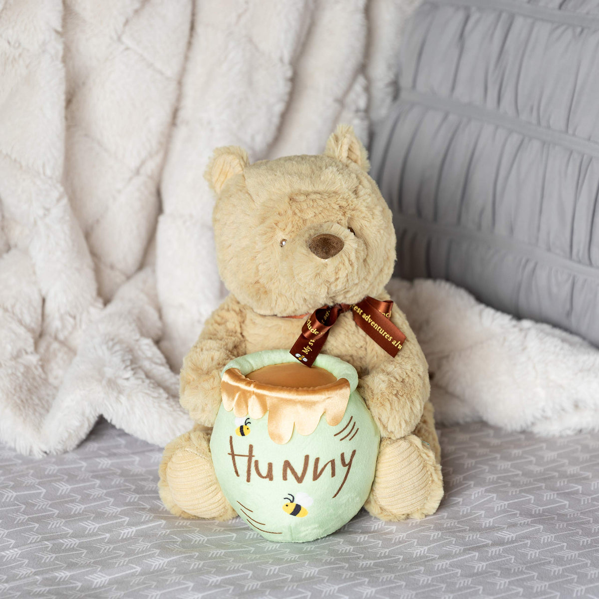 Soft plush texture of Pooh Waggy supports comforting companionship.