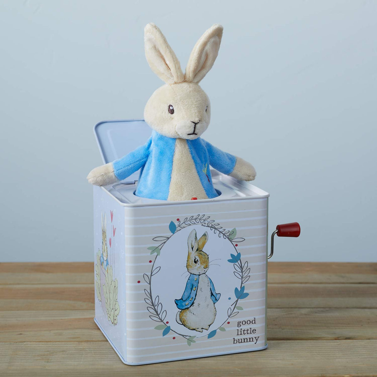 Good Little Bunny artwork on jack-in-the-box enhances nursery decor.