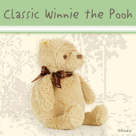 Kids Preferred Pooh bear plush side view highlights compact, portable design for travel