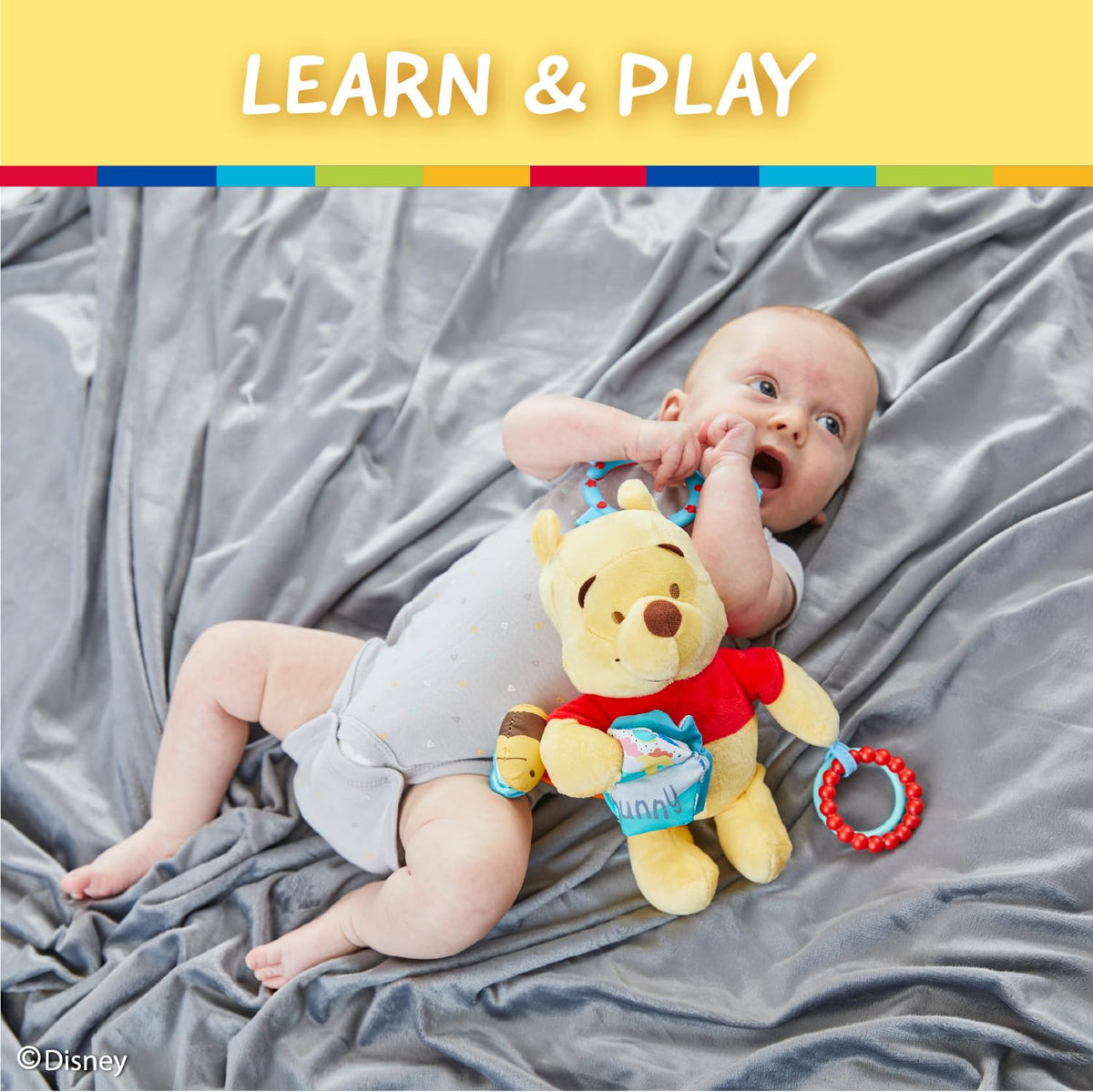On-the-go clip keeps Pooh within reach during stroller rides.
