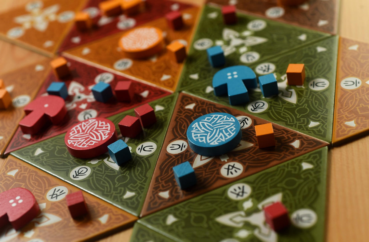 Mycelia tiles offer a flexible setup that reshapes the board between rounds.