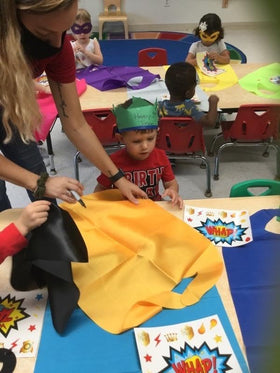 Kidsfere party setup with capes and masks inspires classroom teamwork