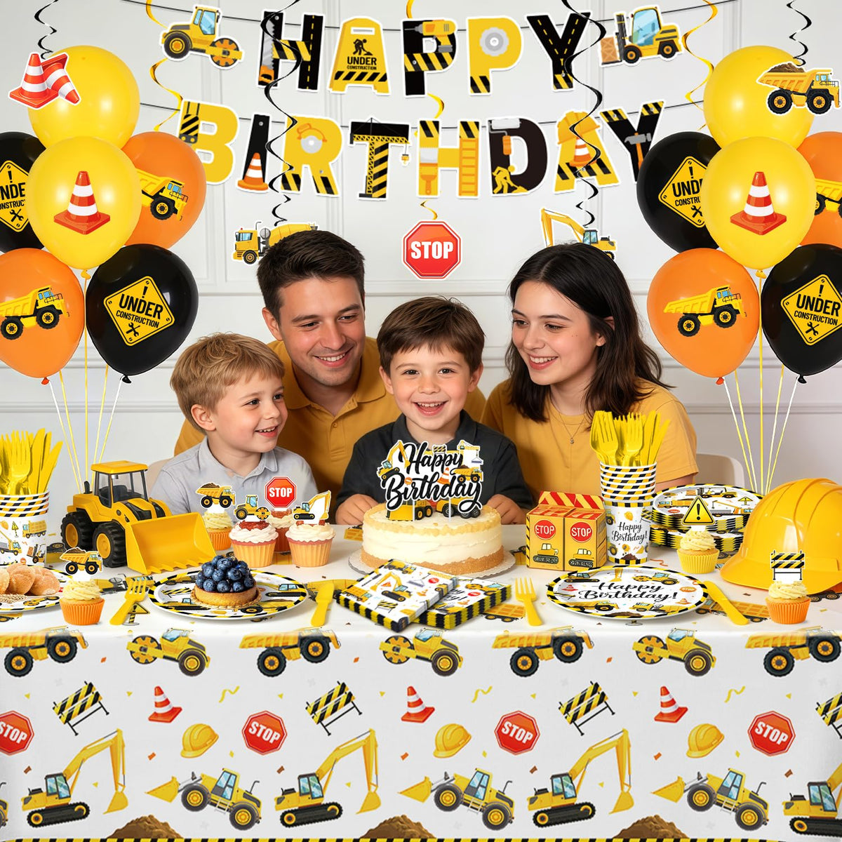 Kinovo construction tablecloth balloons cake topper complete the truck-themed celebration.