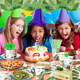 Kinovo dinosaur party-scene tableware highlights cohesive Jurassic decor.