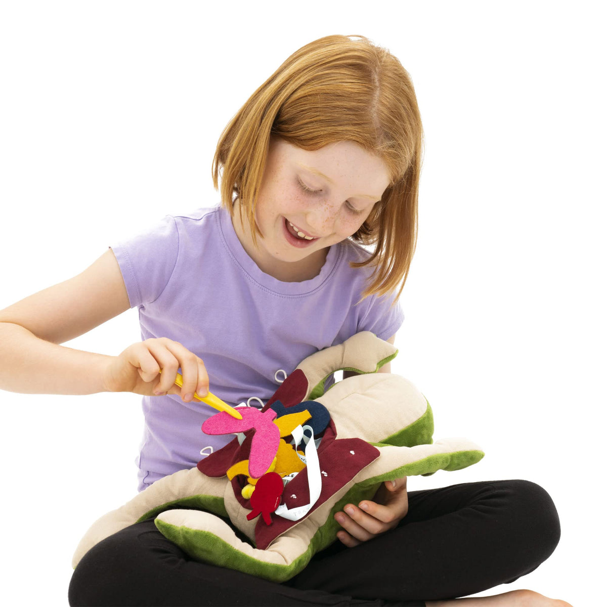 KiwiCo Froggie opened plush with kid-friendly tweezers for hands-on anatomy.