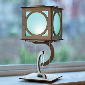 KiwiCo levitating lantern levitation-action captures the physics in motion and balance.