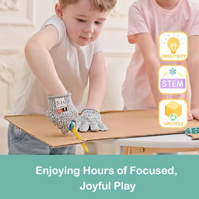 Child using Kizzikids tools to cut cardboard safely