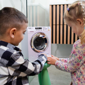 Klein Theo Miele washing machine side crank promotes hands-on pretend play and motor skill use.