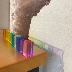 KOAICS Rainbow Crystal Strip Blocks near a window create shimmering shadows and color accents.