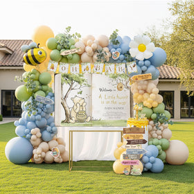Kozee Classic Winnie balloon arch: a dreamy centerpiece for baby boy celebrations.