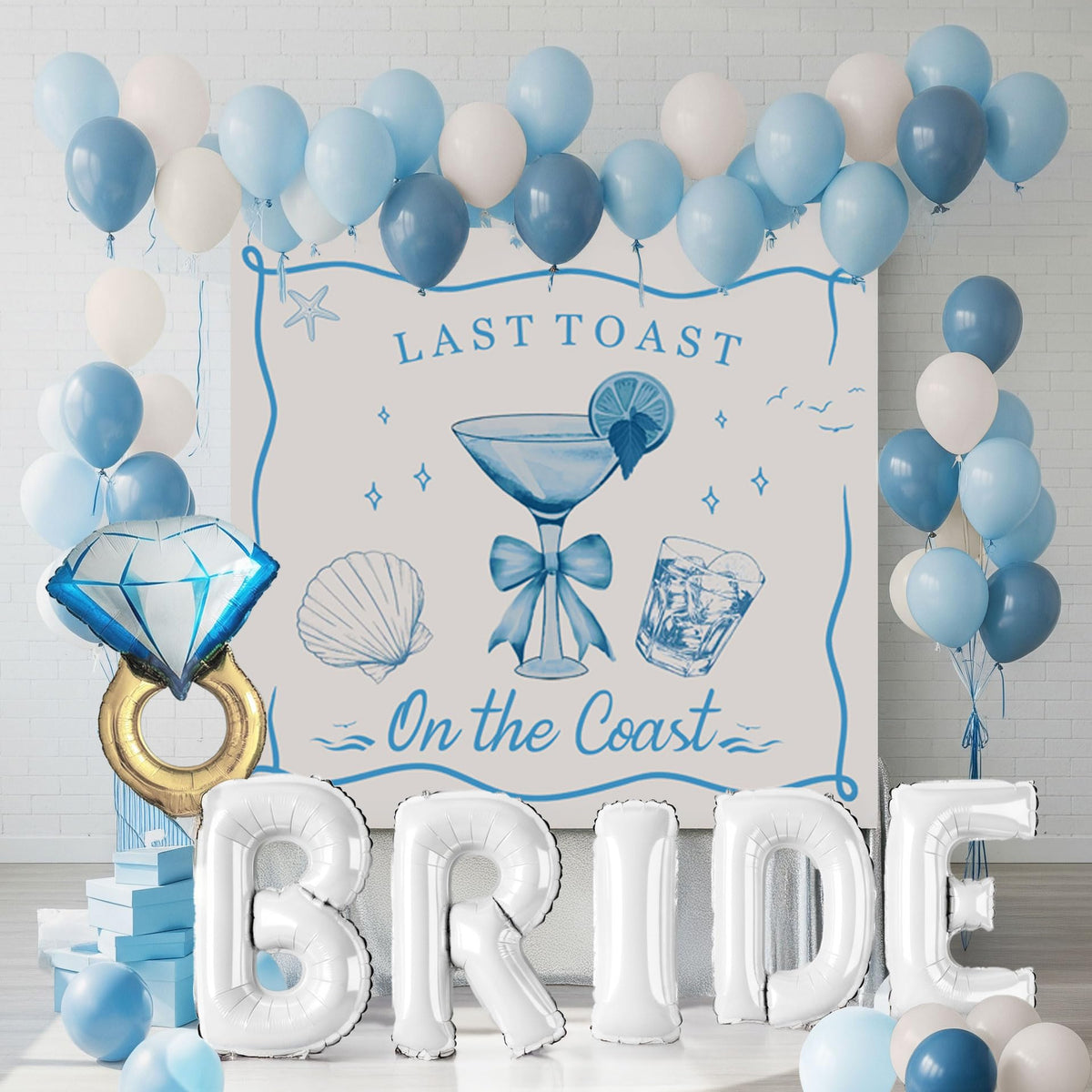 Kozee Last Toast on the Coast balloon garland creates a vibrant coastal backdrop for photos.