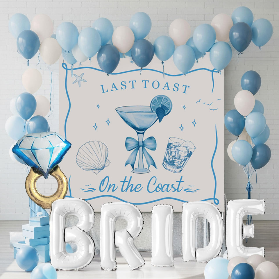Kozee Last Toast on the Coast balloon garland creates a vibrant coastal backdrop for photos.