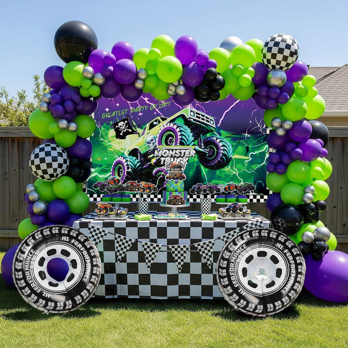 Kozee Monster Truck balloon arch showcases bold purple, green, and black colors for a photo-worthy centerpiece.