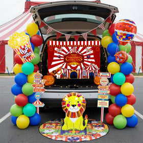 Kozee backdrop and road sign paper for immersive carnival decor.