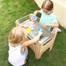 KRAND sand and water tub content closeup highlights textural learning opportunities