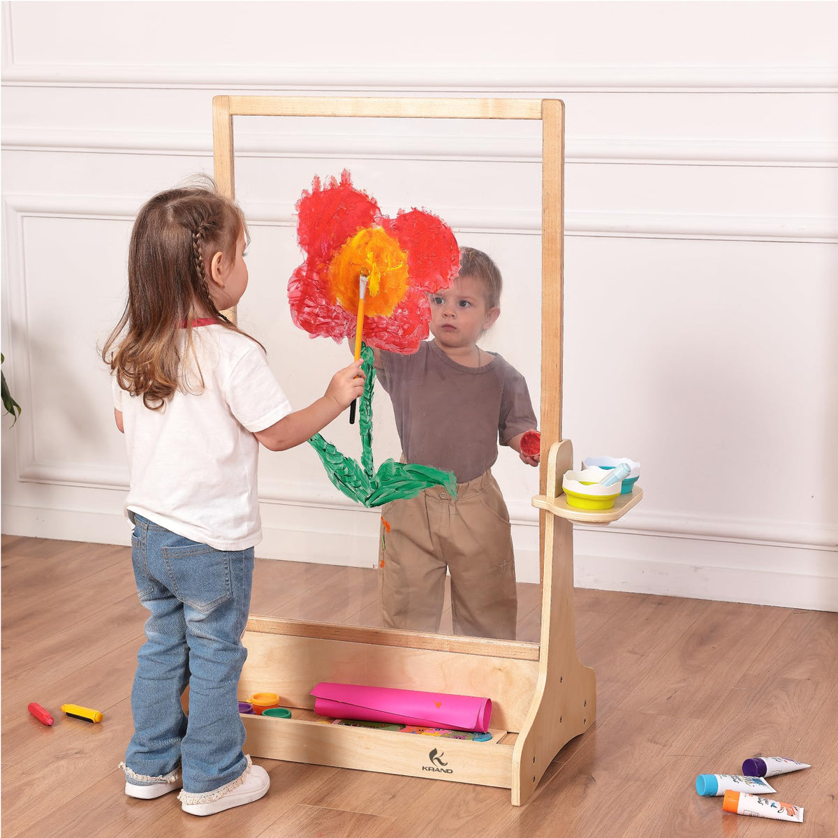 KRAND see-through painting surface enables layered effects during kids' art play.