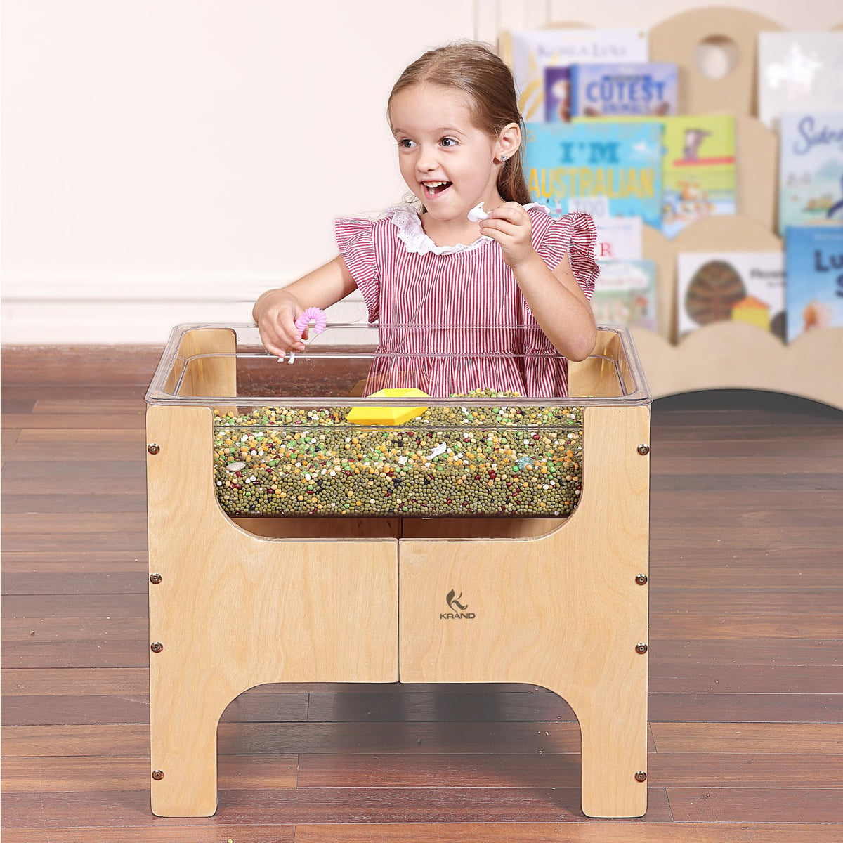 KRAND toddler pouring water beads fosters independent play and fine motor skills