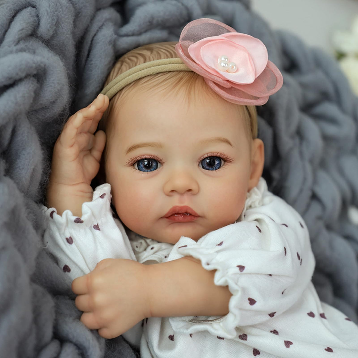 KSBD reborn doll with hand-painted hair and lashes for authentic look.