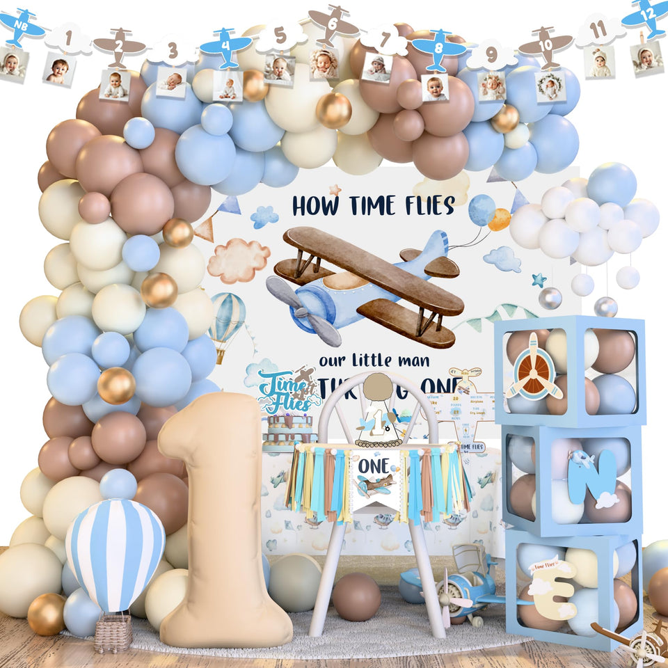 Kudapity Time Flies balloon arch backdrop for a sky-themed first birthday photo moments