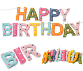 KUQJJQU happy birthday banner visible as a festive party backdrop.