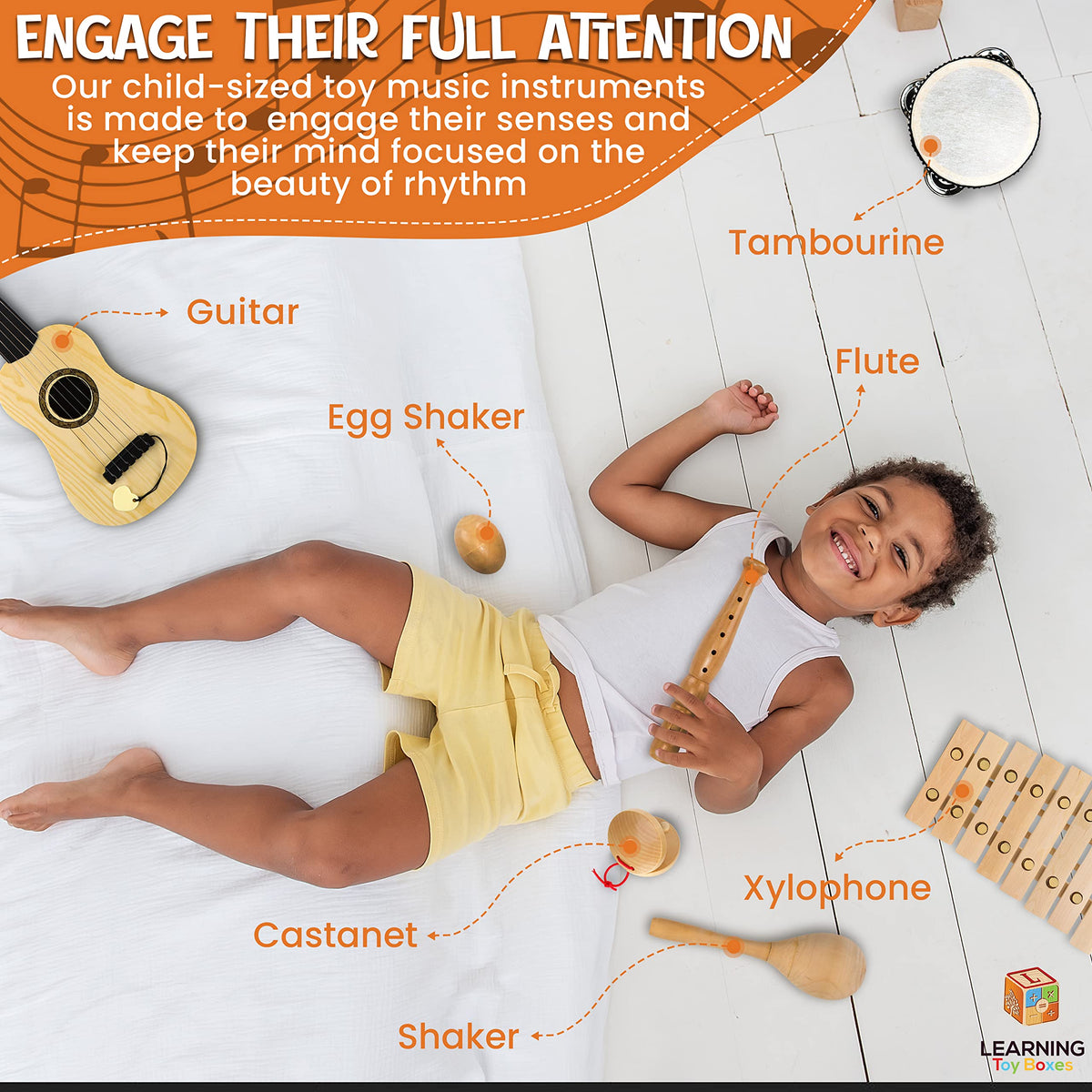 L Learning Toy Boxes castanets image reveals natural wood texture for sensory play