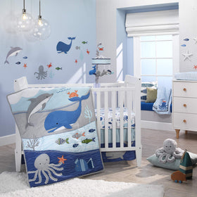 Inky octopus plush with decorative pompoms, ideal for nursery decor