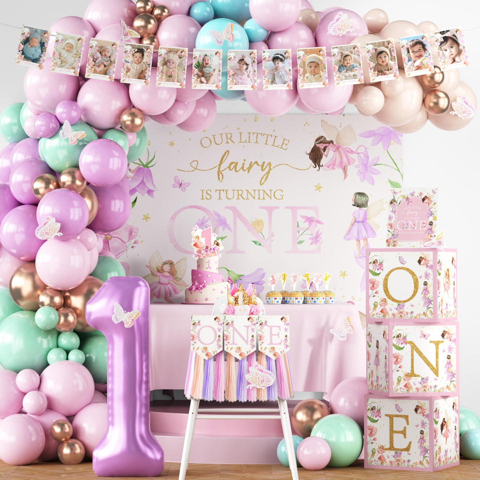 Langasque fairy banner arch creates a magical first birthday backdrop