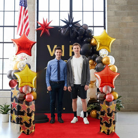 LaRandom 10-inch black balloons provide dramatic contrast for ceilings or arches