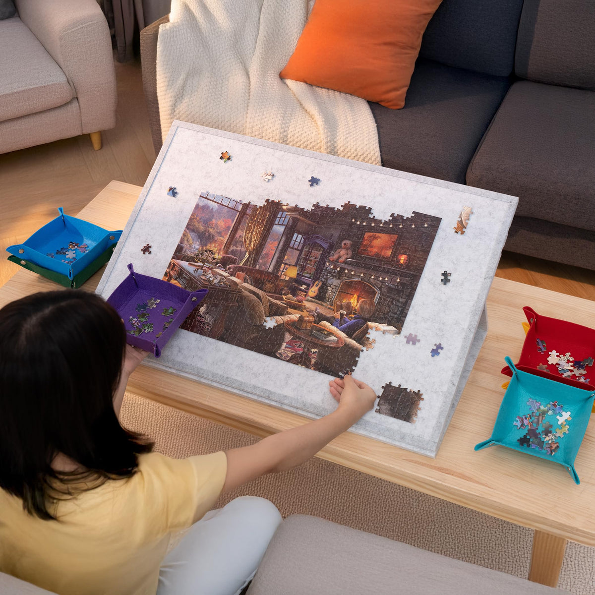 Compact storage under a sofa or bed to keep unfinished puzzles safe