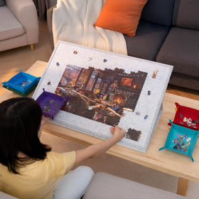 Compact storage under a sofa or bed to keep unfinished puzzles safe