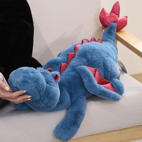 Leahaoe weighted dragon plush on bed demonstrates calming weight during bedtime routines.
