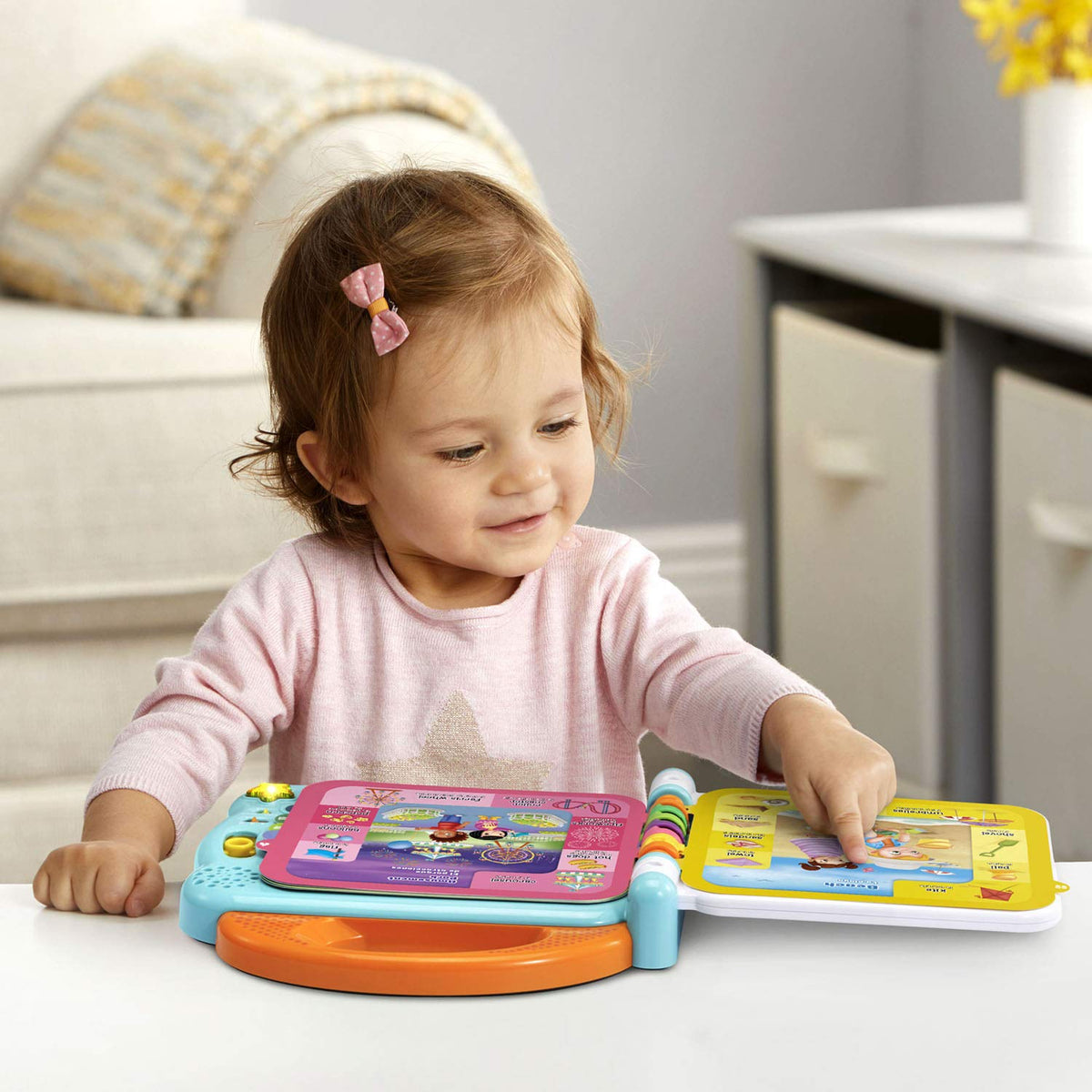 LeapFrog 100 Words About Places demo songs button demonstrating bilingual tunes