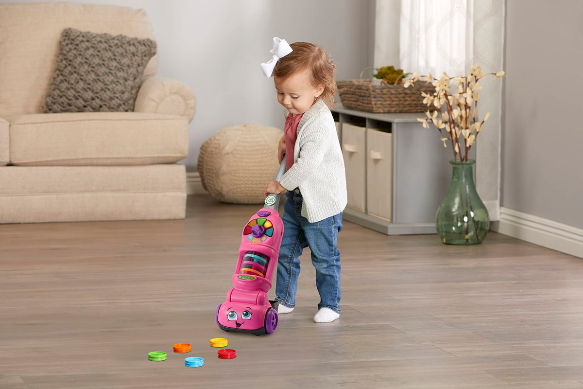 LeapFrog pink vacuum for ages 2+ encourages color and number learning through pretend chores.
