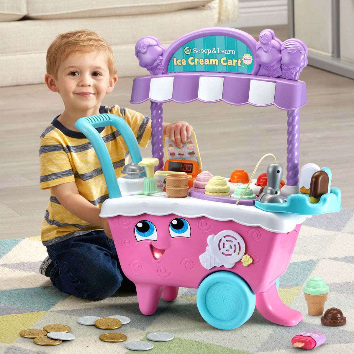 LeapFrog Scoop and Learn Ice Cream Cart Deluxe pink bell signals order readiness.
