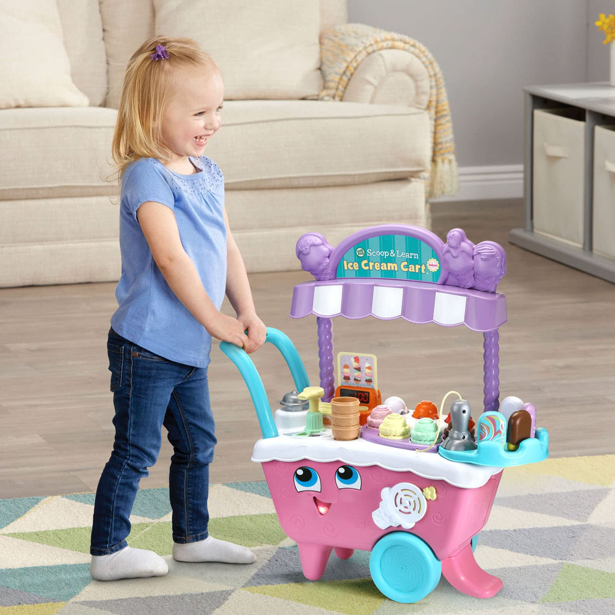 LeapFrog Scoop and Learn Ice Cream Cart Deluxe pink songs boost engagement during play.