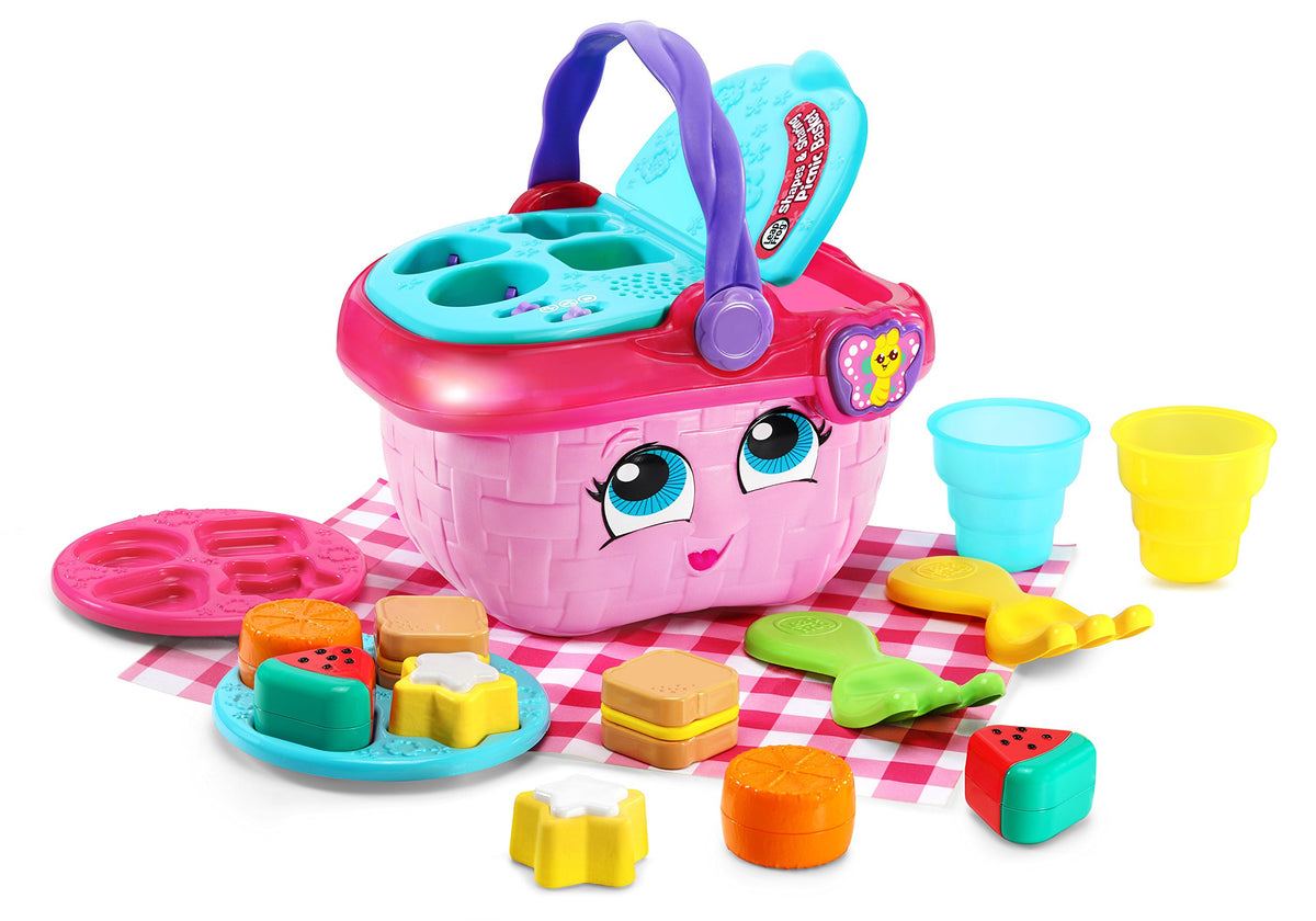 LeapFrog Shapes and Sharing Picnic Basket lid open with colorful play pieces for pretend play