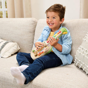 LeapFrog Strum and Count wooden guitar offers acoustic, electric, and barnyard sounds.