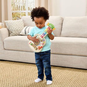 LeapFrog Strum and Count wooden guitar squirrel tail triggers music and language games.