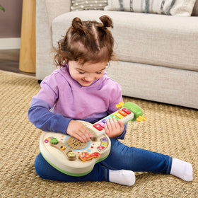 LeapFrog Strum and Count wooden guitar strings invite strumming and creative tunes.