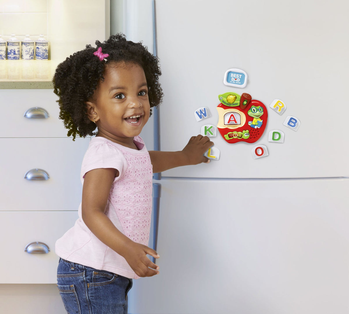 LeapFrog Tad's Fridge Phonics custom photo tiles personalize play for your child.