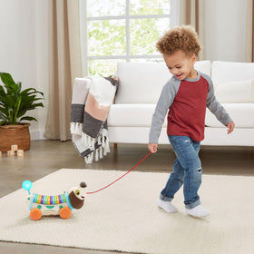 AlphaPup encourages walking and pulling to support motor skill practice.