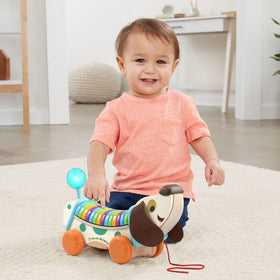 Letter buttons play songs and doggy phrases for playful feedback.