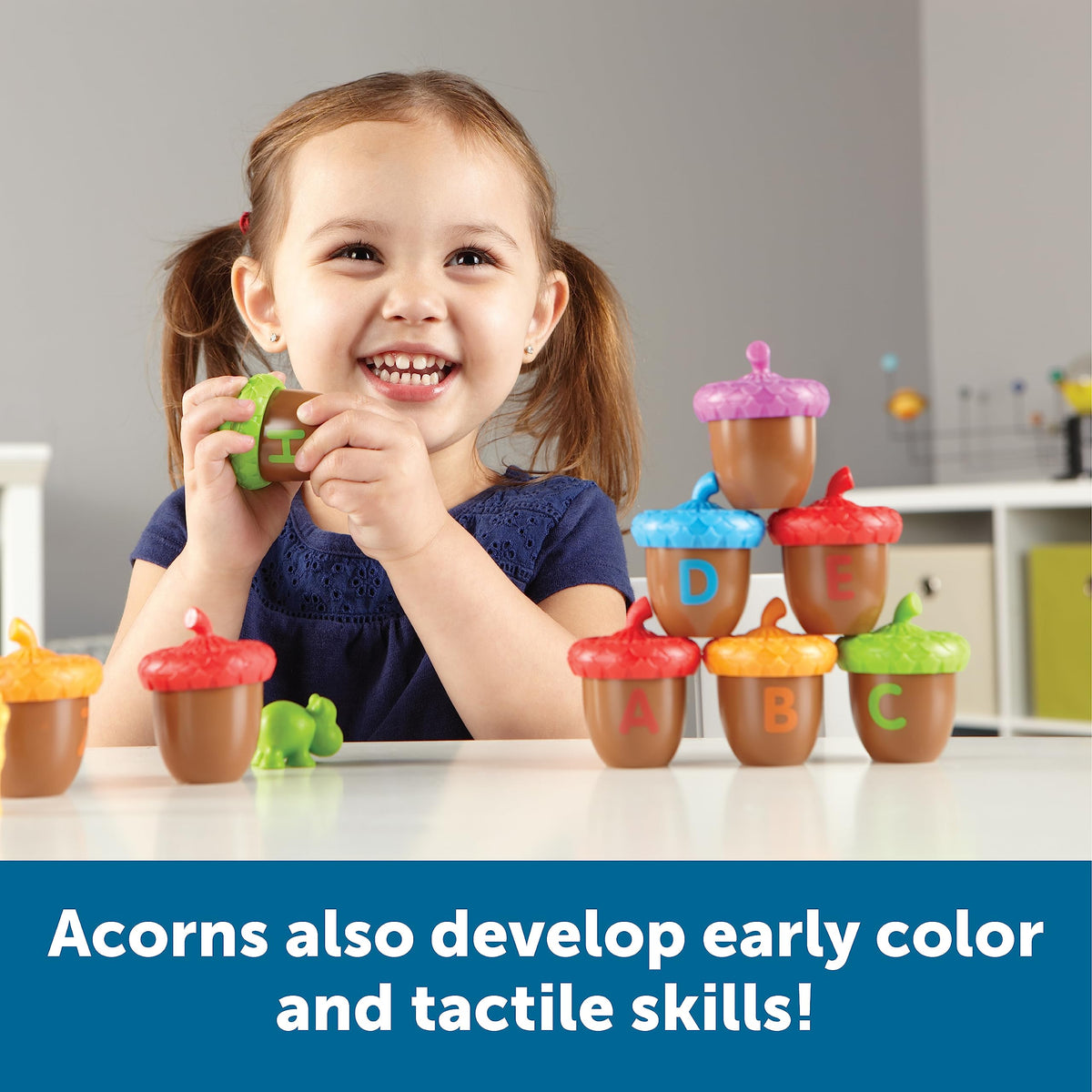 Learning Resources Alphabet Acorns Cap Open demonstrating opening action to boost fine motor skills