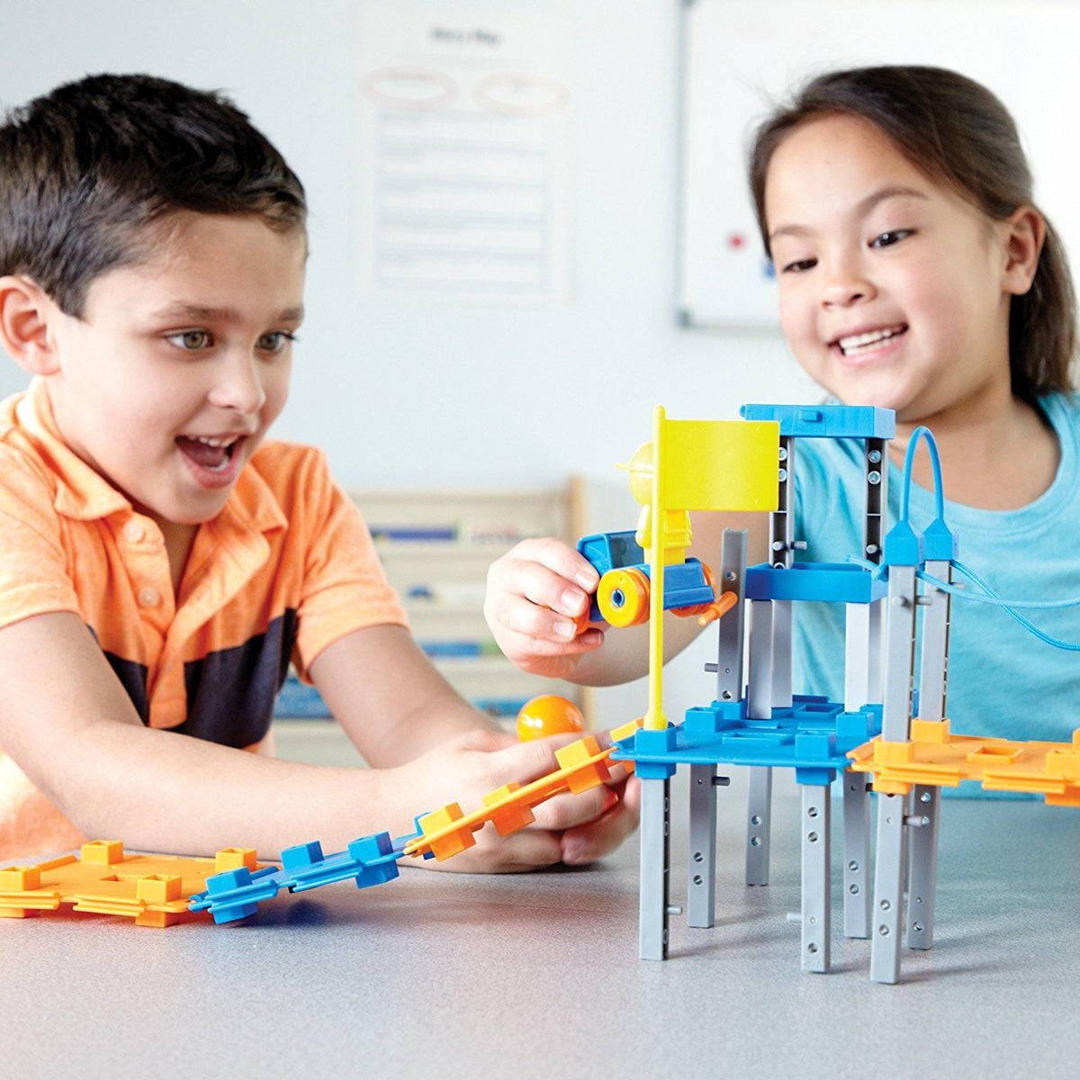Assorted 89 buildable pieces from Learning Resources laid out for city-building projects.