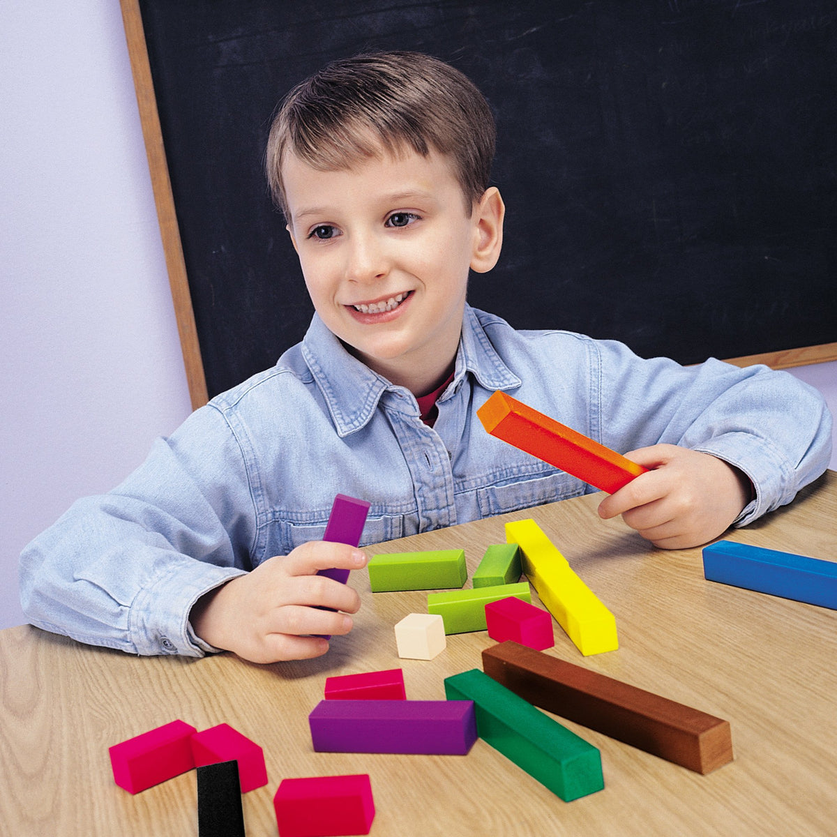 Learning Resources Fraction Tower Cubes color-coded sides aid quick recognition of fractions.
