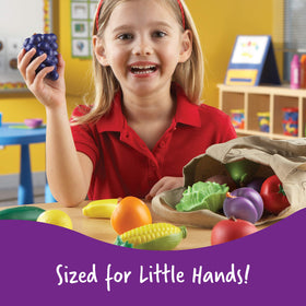 Lettuce and carrot visible in Learning Resources tote for early language learning