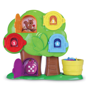 Learning Resources Hide & Seek Treehouse apples tumbling through the chute supports fine motor skills.